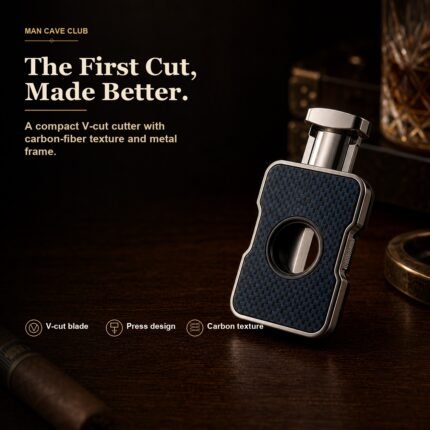 blue-black carbon fiber texture V-cut cigar cutter with metal frame on a cigar desk