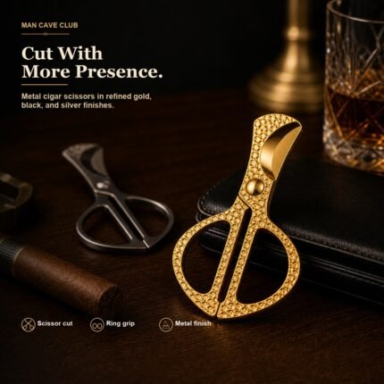 portable stainless steel cigar scissors cutter with double finger-ring grip on a cigar table